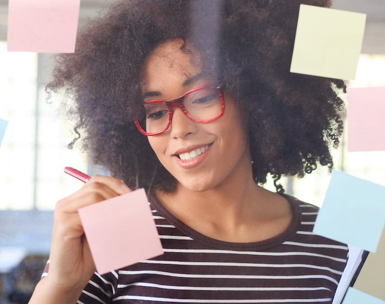 web designer working with post it notes