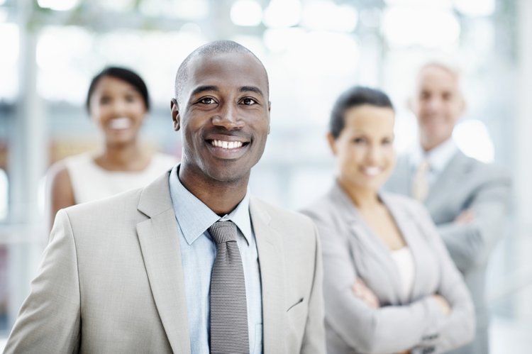4 Business People with African American Male in front t750x550