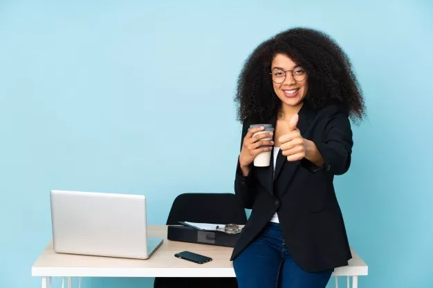 african american business woman working her workplace with thumbs up because something good has happened 1368 122475